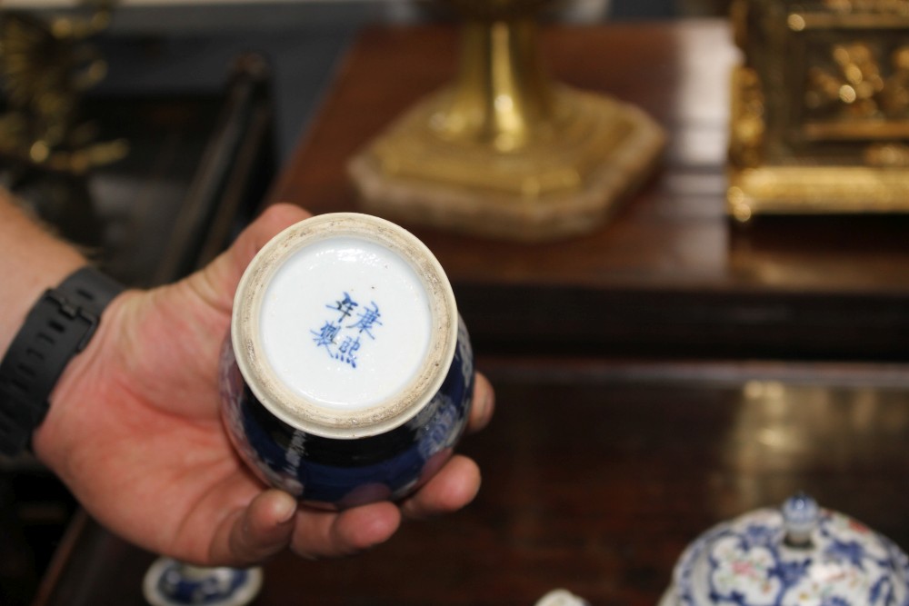 An 18th century Chinese export teapot and a pair of prunus pattern vases and covers